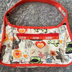 LeSportsac shoulder bag in orange cream with horses bunnies frogs and cats cute